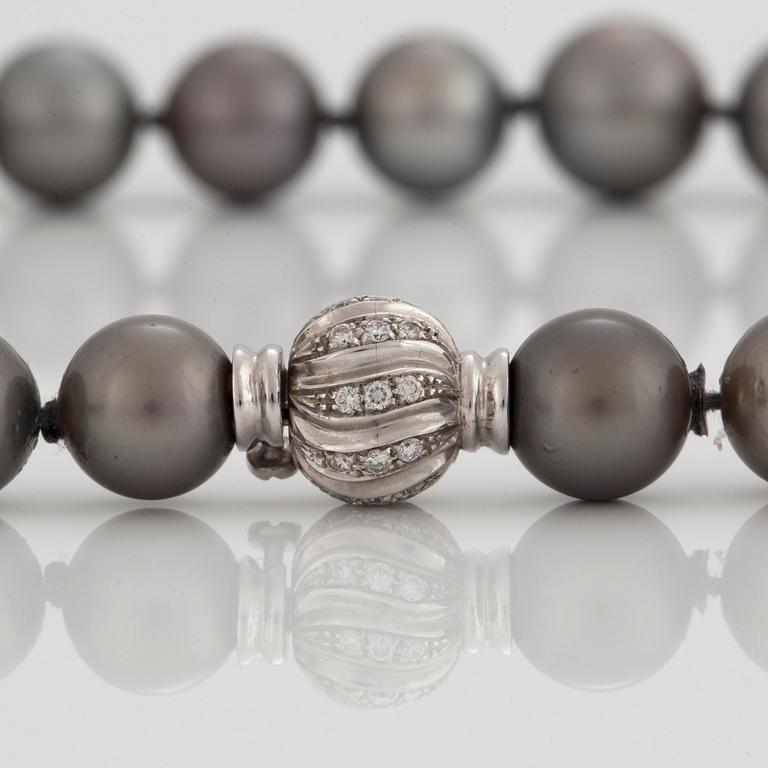 A NECKLACE of cultured Tahiti pearls.