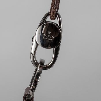 VÄSKA samt SKÄRP, Gucci.