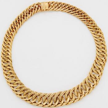 Georges L'Enfant an 18K gold demi parure comprising a necklace, a bracelet and a ring.