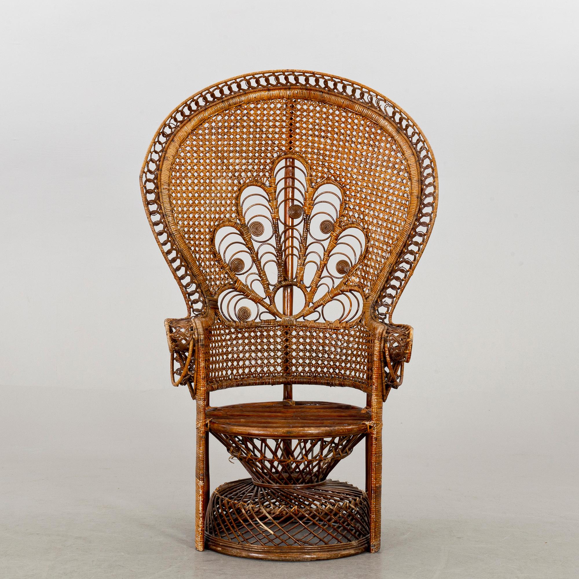 A RATTAN ARMCHAIR.
