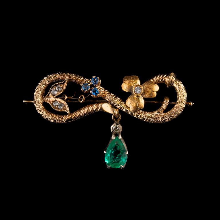 A BROOCH, 56 gold, drop cut emerald, diamonds, sapphires. Marked AT. St. Petersburg 1880 s. Weight 4,7 g.