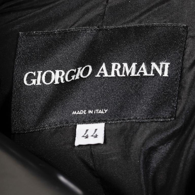 ARMANI, a black velvet evening jacket with silk details.