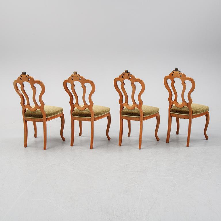 A rococo style sofa, four chairs and a table, second half of the 19th Century.