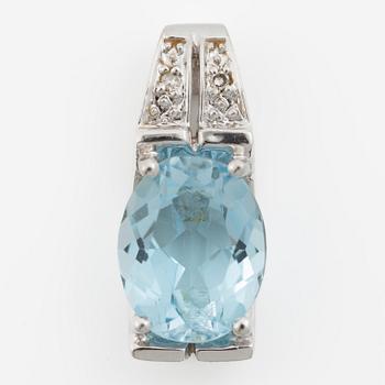 Pendant in 18K gold with a topaz and small diamonds.