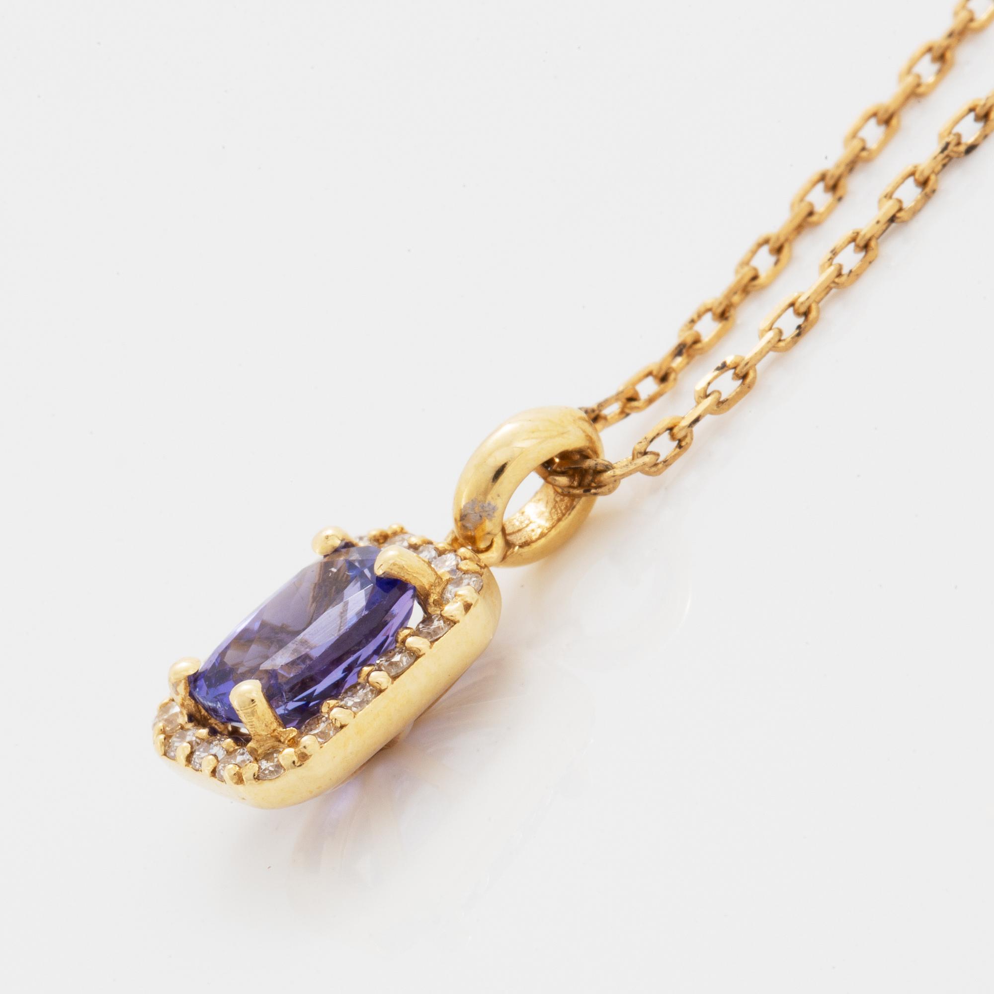 An 18K gold necklace set with a faceted tanzanite.