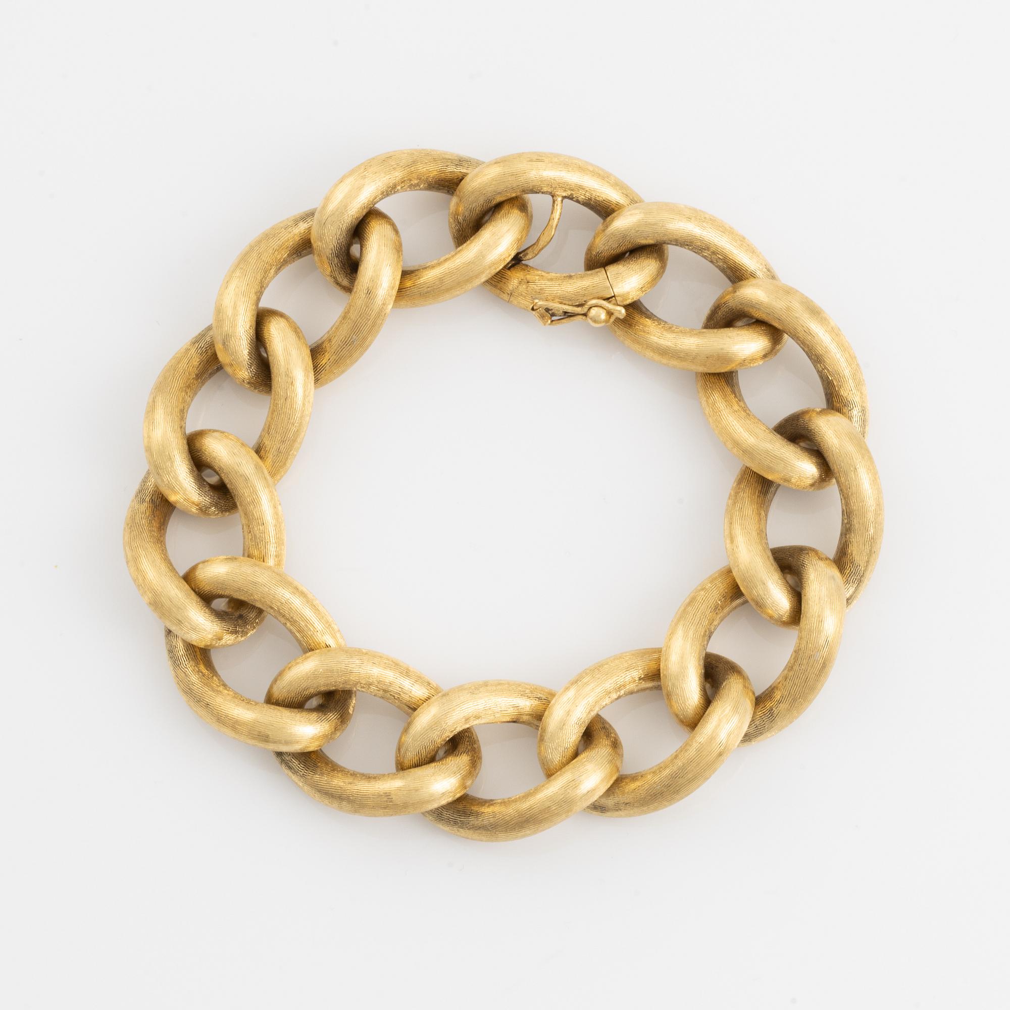 An 18K gold bracelet.