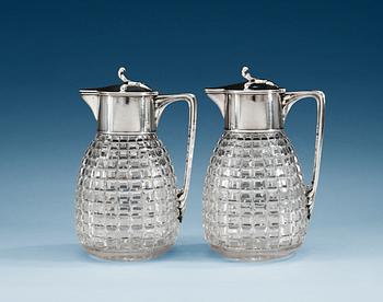 840. A PAIR OF SWEDISH SILVER AND GLASS WINE-JUGS, Makers mark of W.A. Bolin, Stockholm 1920.
