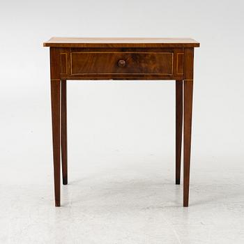 A mahogany veneered table, circa 1800.