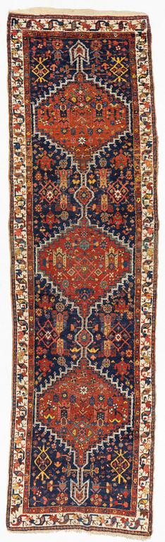 An antique runner, probably Karadja, circa 360 x 98 cm.