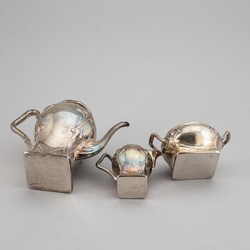 An art nouveau silver coffee pot, sugar bowl and creamer, mark of CF Källström, Malmö 1901.