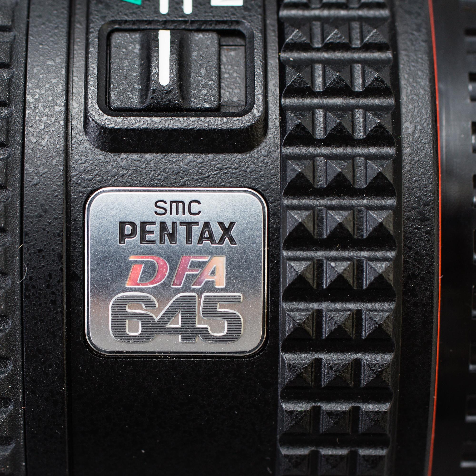 A black body medium format Pentax 645D camera with a SMC Pentax-D FA 645 55mm F2.8 AL [IF] SDM AW lens.