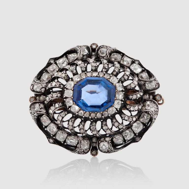 A sapphire and antique-cut diamond brooch, total carat weight circa 3.50 cts. Reworked from necklace-clasp into a brooch.