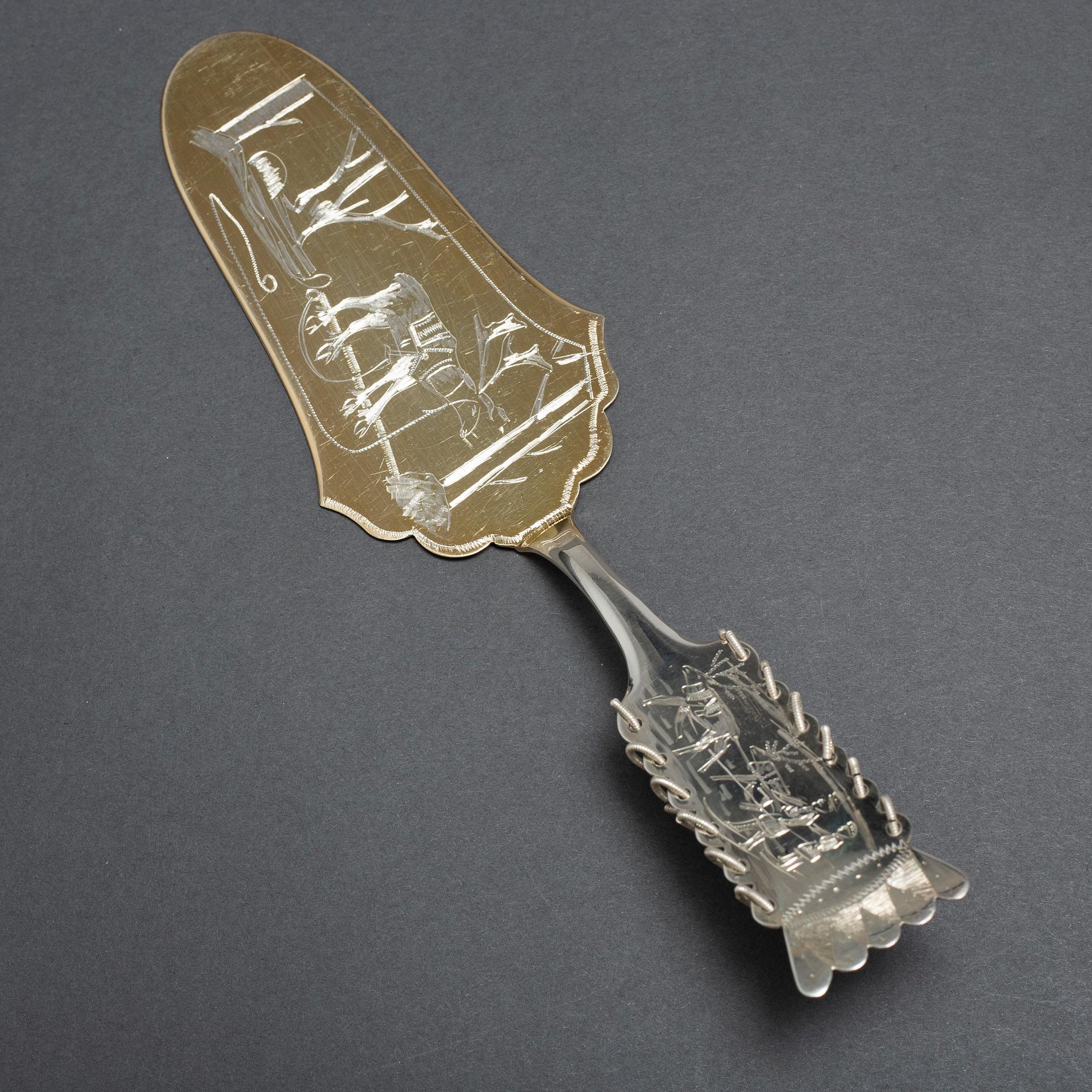 A SILVER CAKE KNIFE AND 12 COFFEE SPOONS, samian, second half of the 20th century.