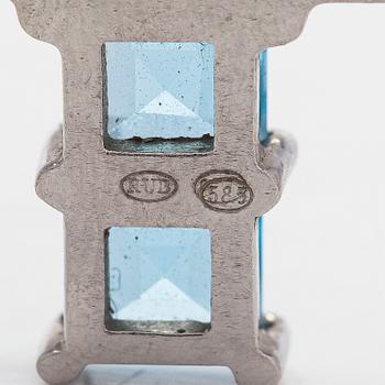 Hänge i form av kors, 14K vitguld med topaser.