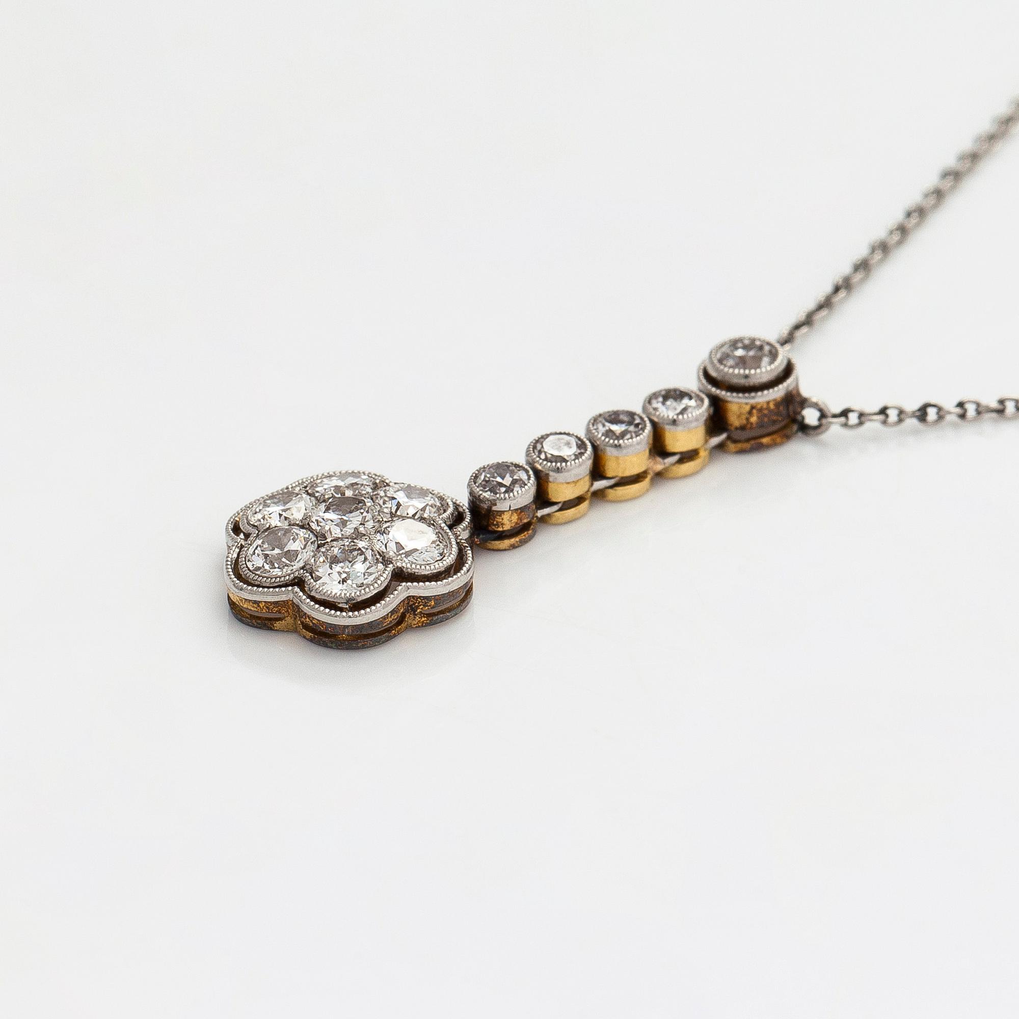 A platinum/17K gold necklace, set with old-cut diamonds, first half of the 20th century.
