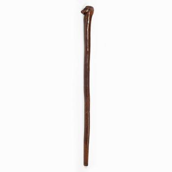 A mahogany woodcarved cane, 19th century.