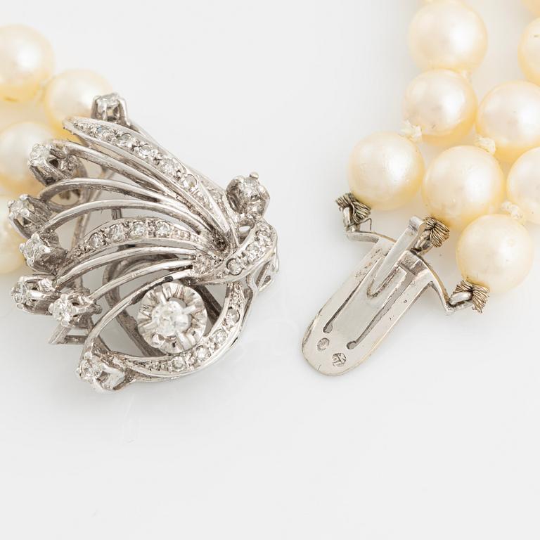 Cultured pearl necklace, three strand, calibrated, clasp with diamonds.