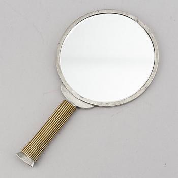 Estrid Ericson & Björn Trädgårdh, a pewter and brass handmirror from Firma Svenskt Tenn.