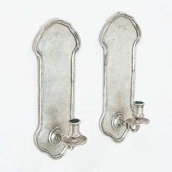 A pair of 1920s-30s tin sconces.