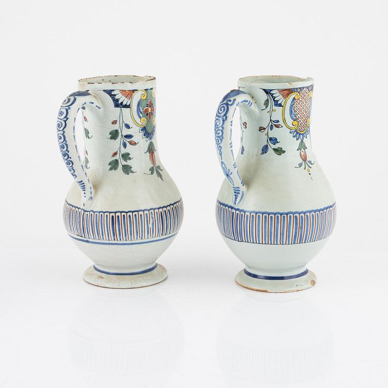 Two earthenware pitchers and one plate, Holland, 18th-19th century.