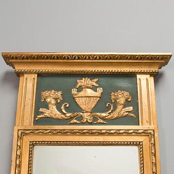 An Empire mirror, first half of the 19th century.