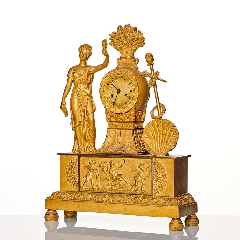 A French Empire gilt bronze mantel clock, 19th century.