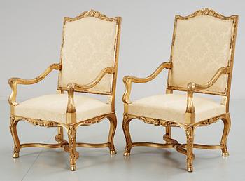 A pair of Régence-style circa 1900 armchairs.