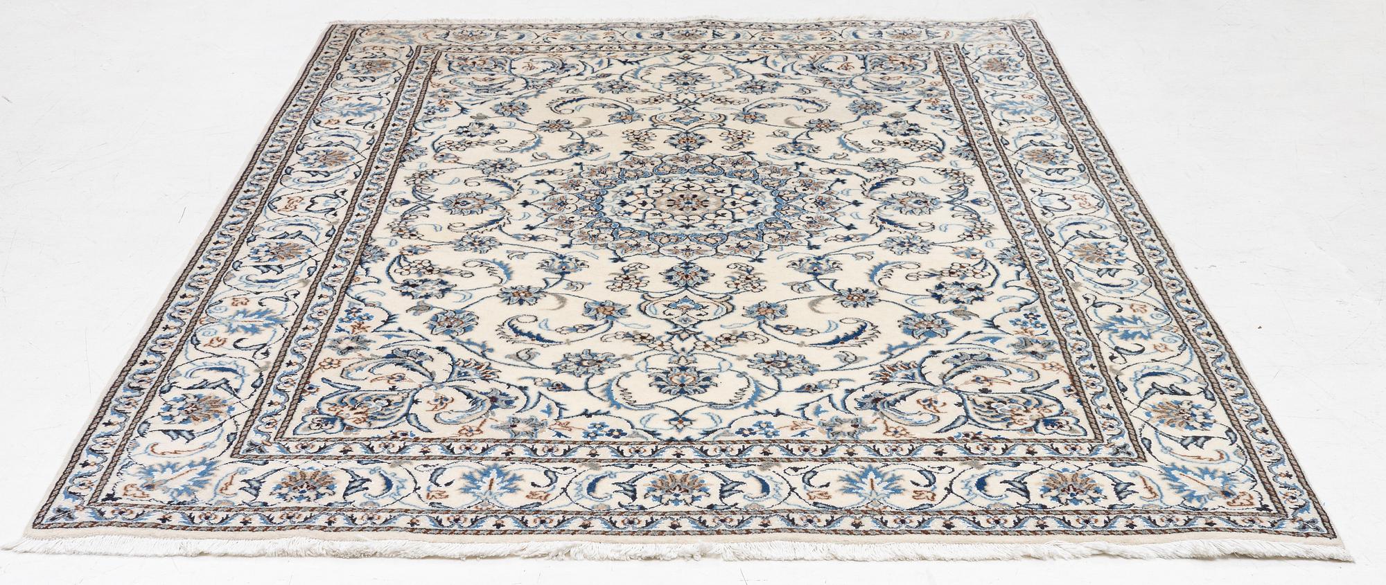 A Nain carpet, c. 275 x 195 cm.