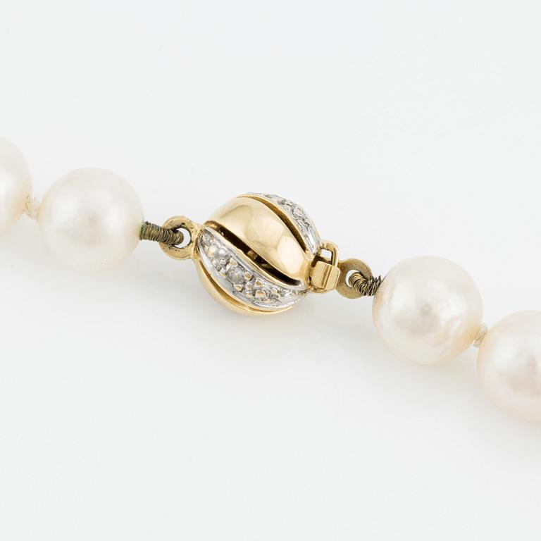 Necklace & bracelet, cultured pearls with 18K gold clasp and small diamonds.