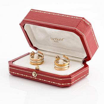 A pair of 18K gold Cartier earrings.