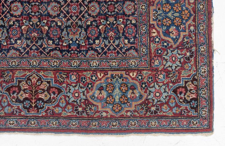 A rug, probably Meshed, semi-antique, c. 180 x 125 cm.