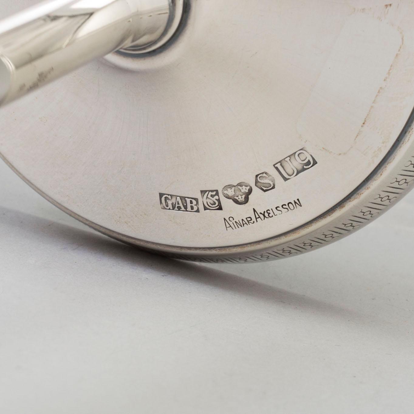 A pair of silver candlesticks by GAB, Stockholm, 1970.