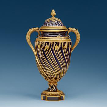 835. A French ormolu mounted 'Sèvres' vase with cover, ca 1900.