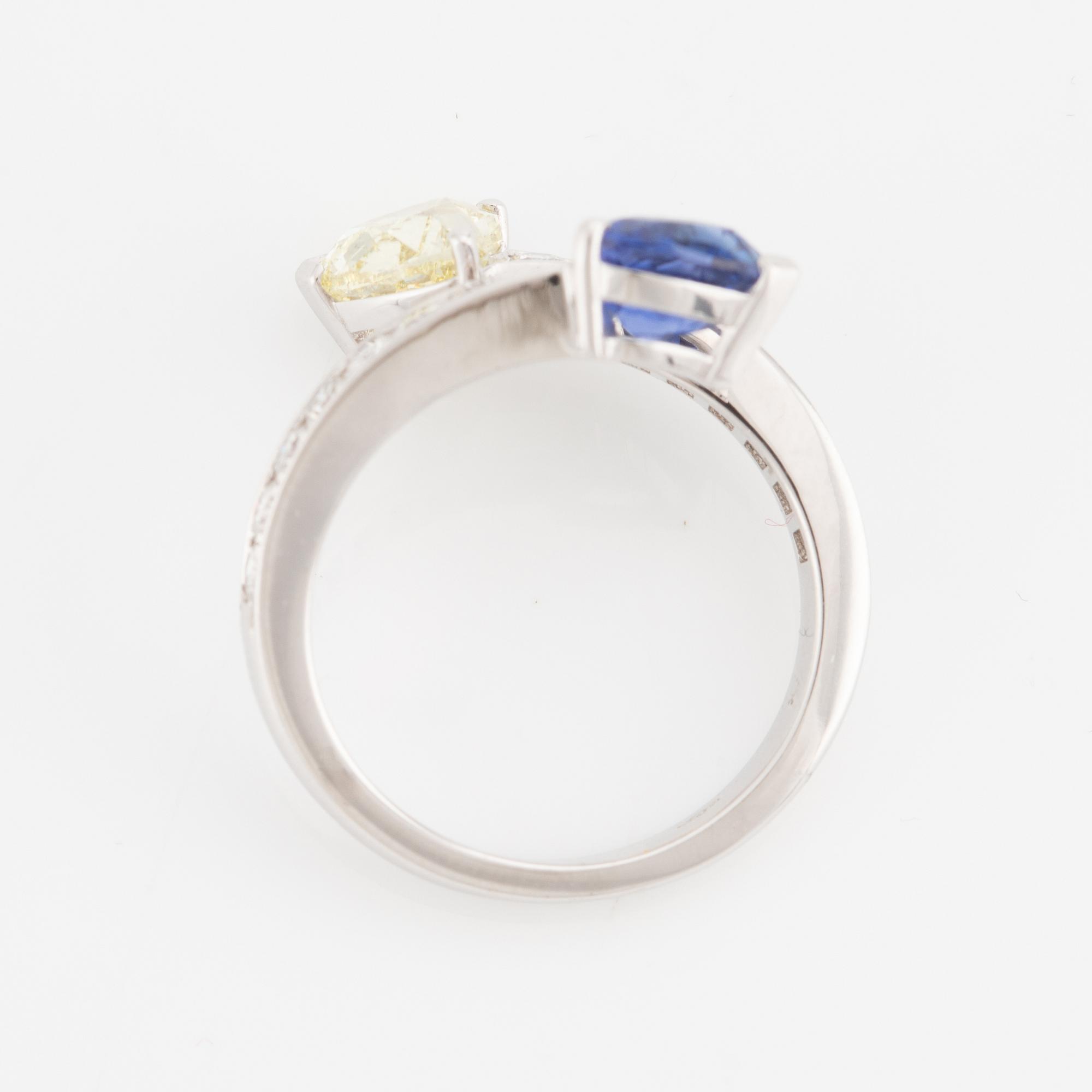 Ring, 18K white gold with a heart-shaped yellow diamond and sapphire, accompanied by GIA report.