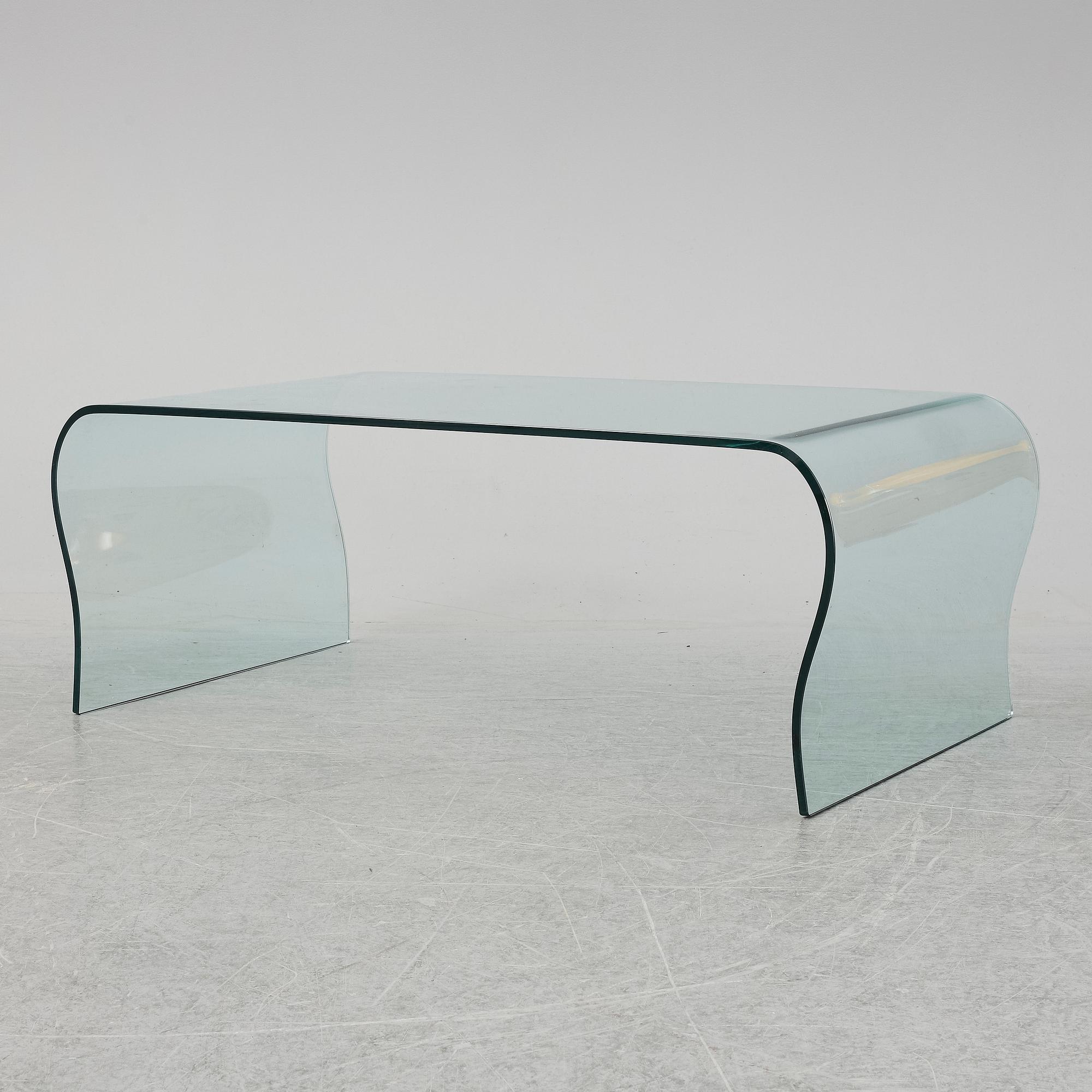 A mid 20th Century glass coffee table.