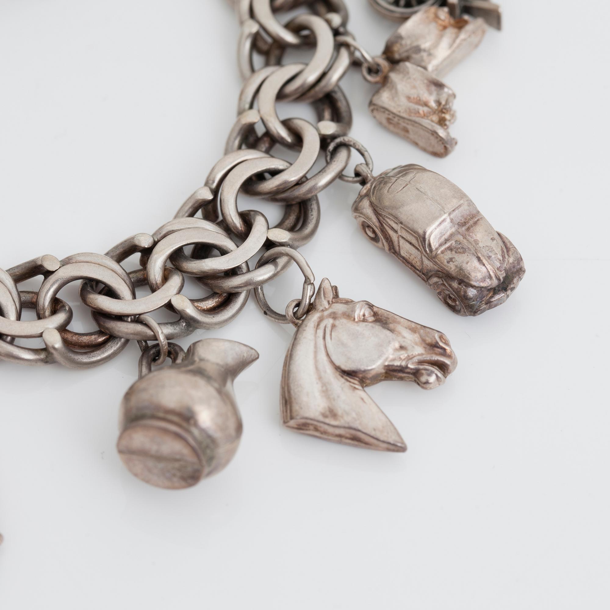 BERLOCKARMBAND, silver, 1900-talets andra hälft.