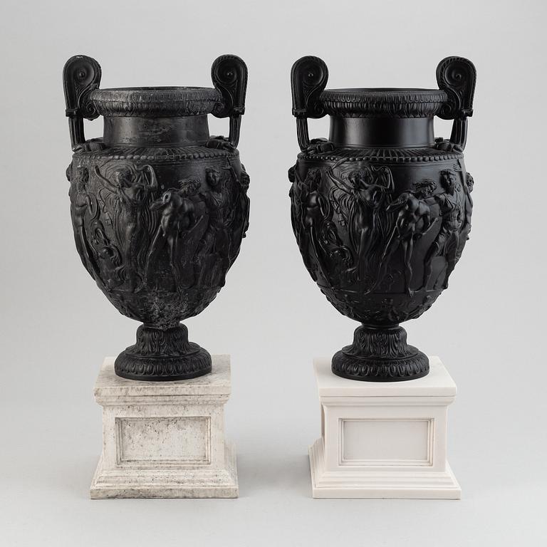 A pair of basalt ware volute vases, 19th century.