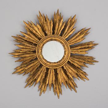 A first half of the 20th century sun mirror.