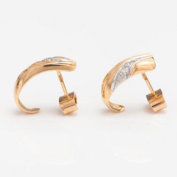 A pair of 14K ogld earrings with diaomnds ca. 0.036 ct in total. Finland 1992.