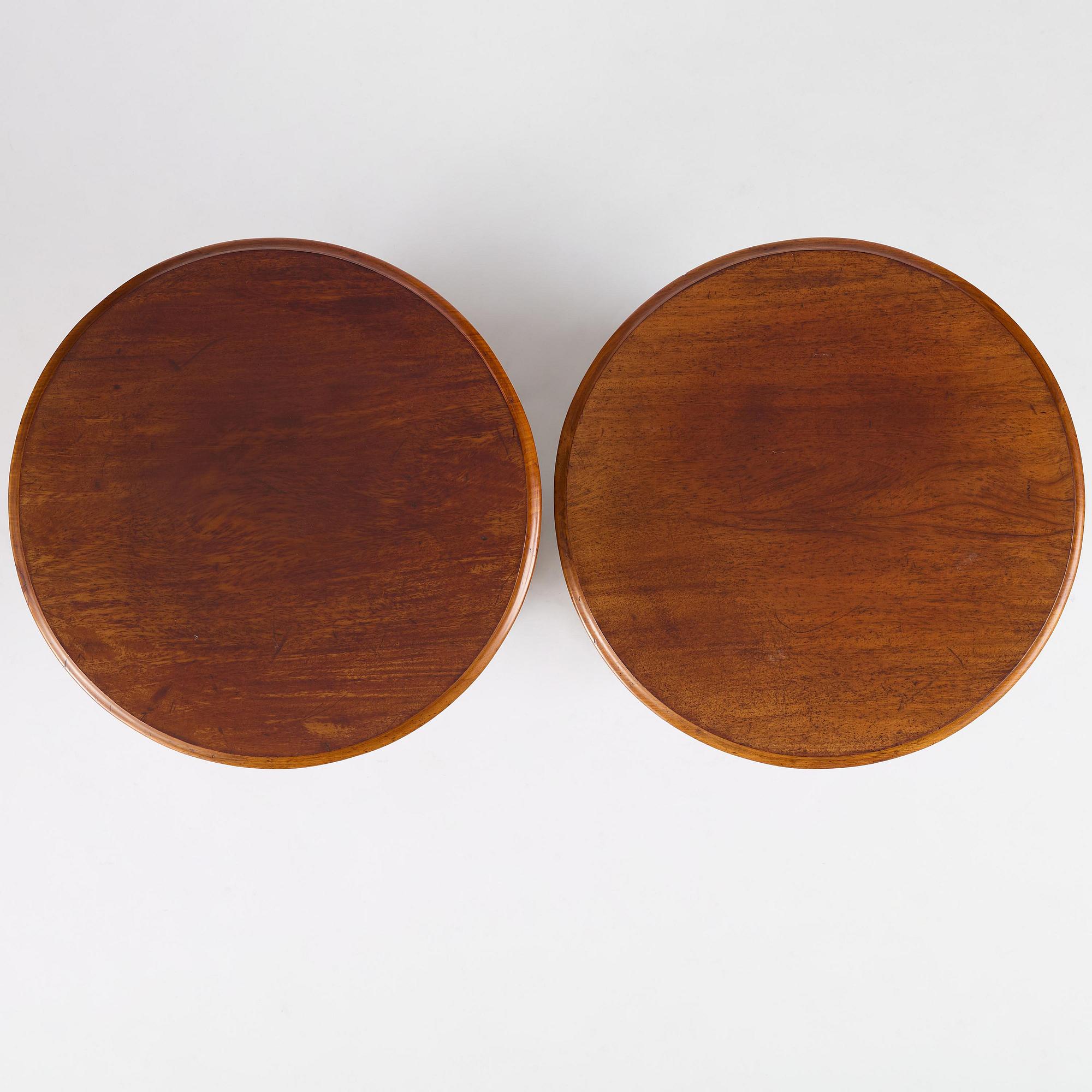A pair of late Empire mahogany column cabinets, mid 19th Century.