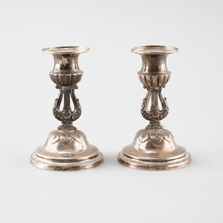 A pair of silver candelsticks by Daniel Eklund, Kalmar, empire, 1854, weight 163.