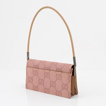 Gucci, a pink canvas handbag.