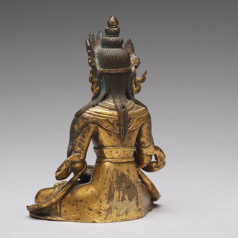 A gilt bronze figure of Amitayus buddha, Tibeto-Chinese, 18th Century.