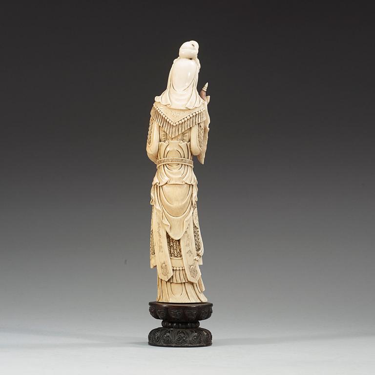 A partly tinted carved ivory figure of the female warrior Mulan, Qing Dynasty, 19th Century.