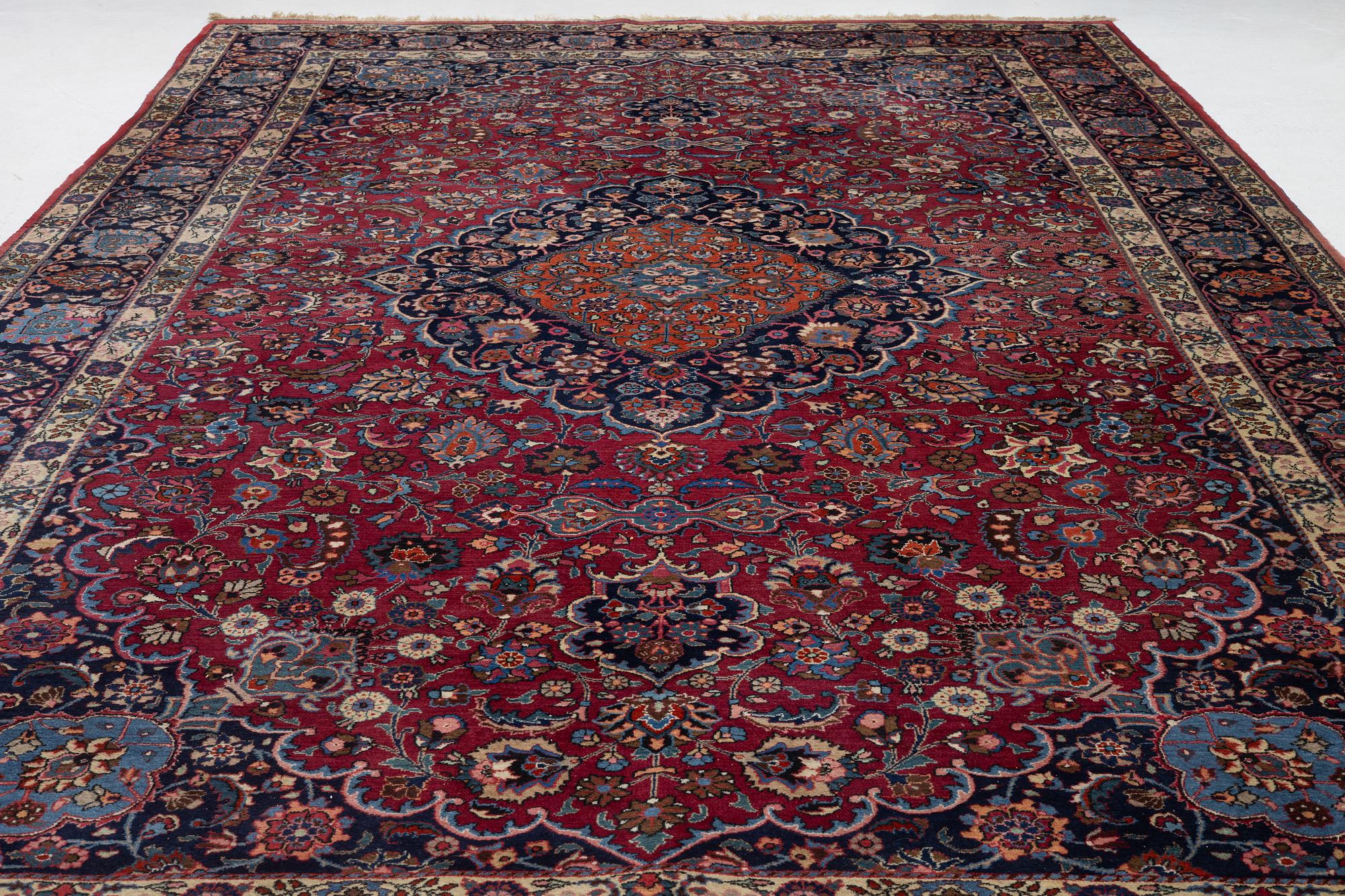 A semi-antique Mashad carpet, Eastern Iran, signed c. 507 x 303 cm.