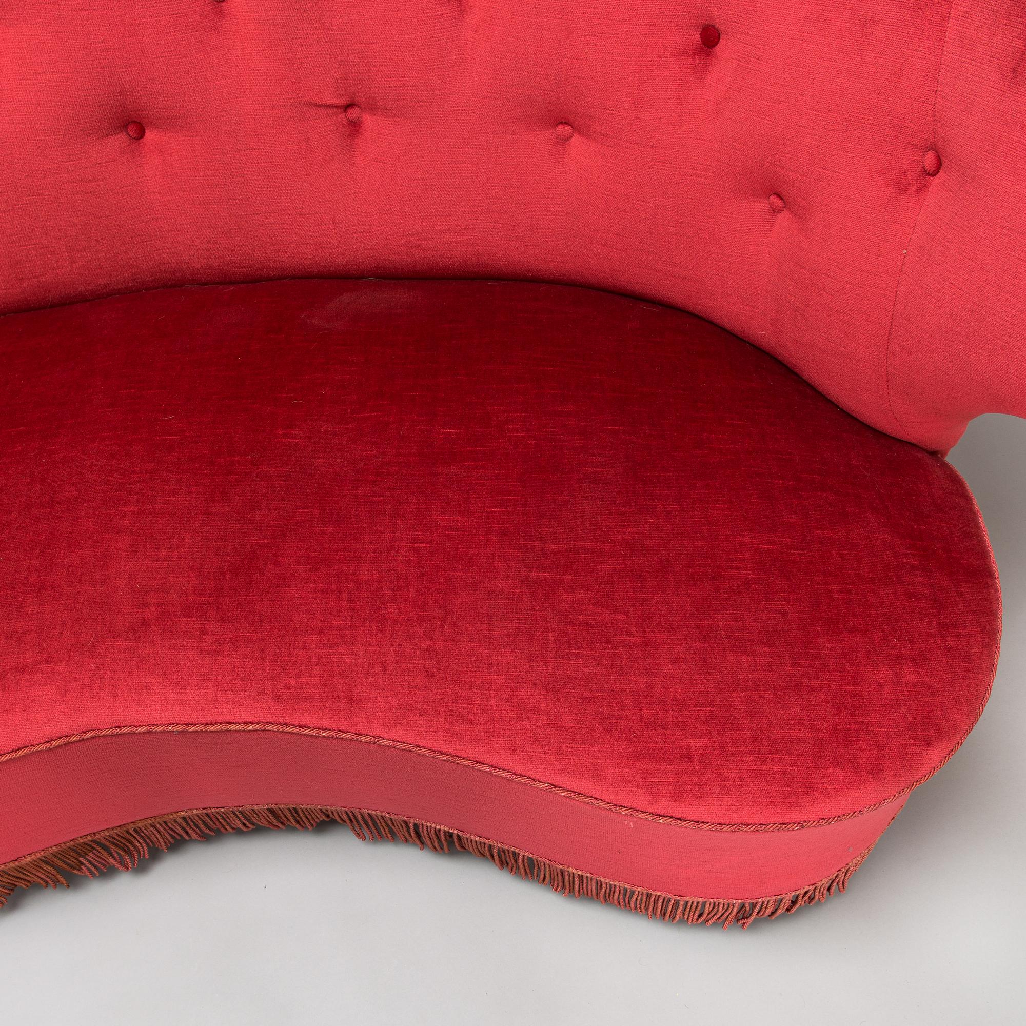 A mid-20th -century sofa and armchair.
