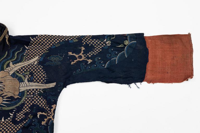 A rare fragment of a silk four clawed 'dragon' jacket, late Ming dynasty/early Qing dynasty.