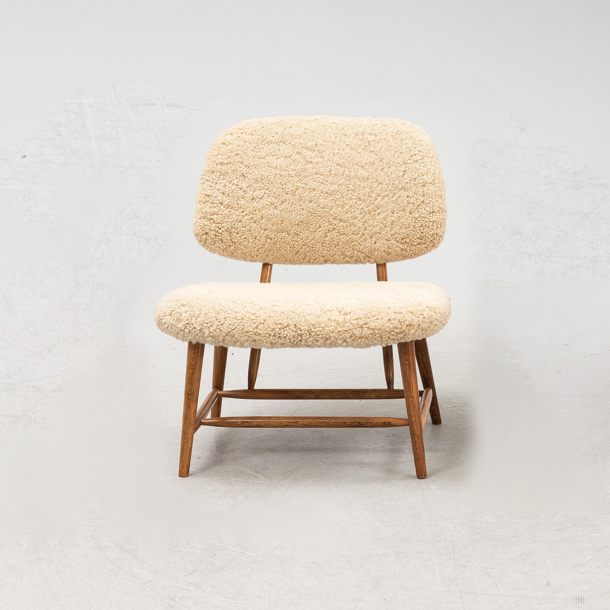 A TeVe easy chair by Alf Svensson, with new sheepskin upholstery, Studio Ljungs Industrier, 1950's.