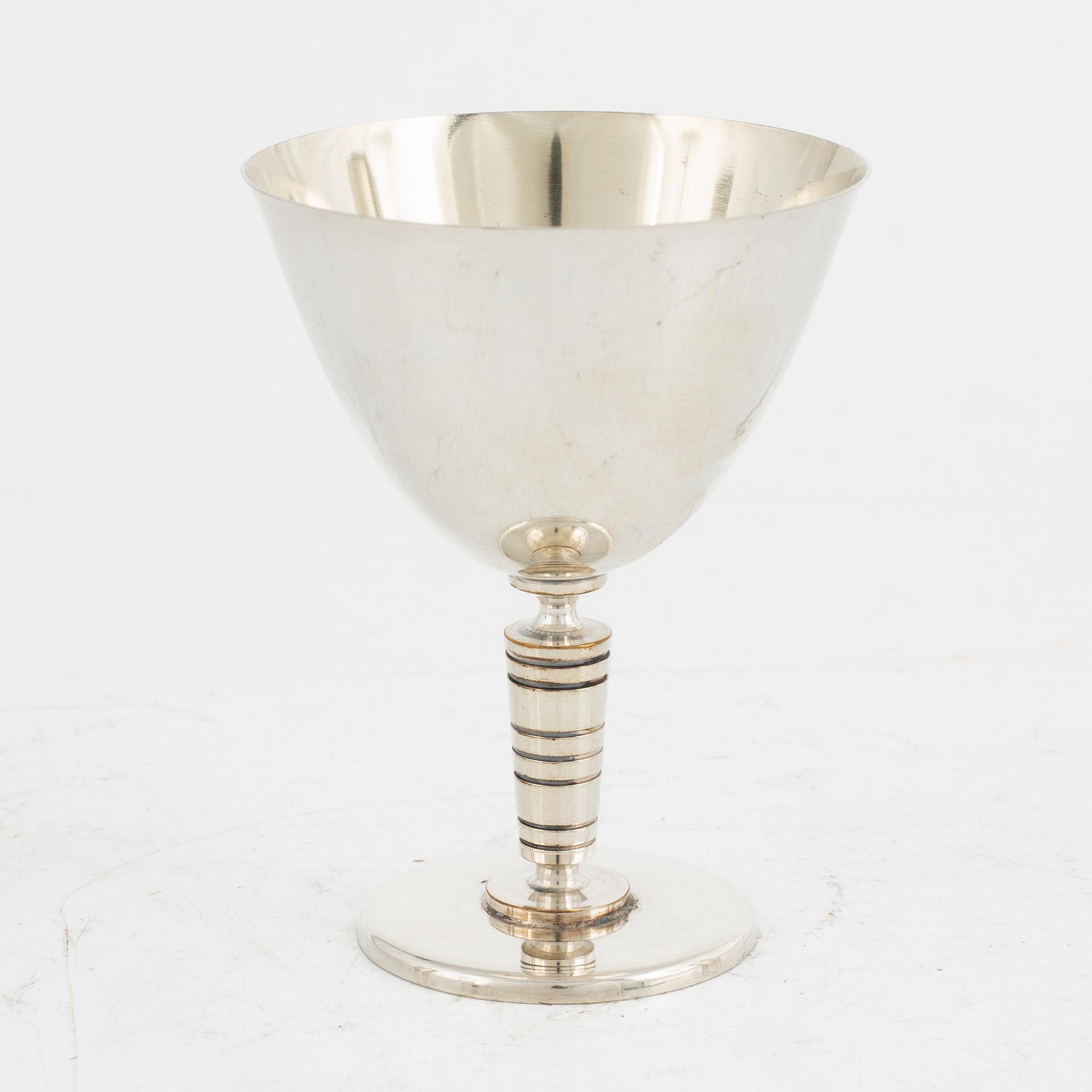Folke Arström, eight silver plate cocktail glasses and a shaker, GAB.