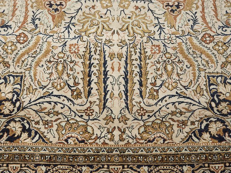 A silk Qum carpet, around  219 x 137 cm.